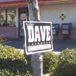 Dave Leckness nails his signs to trees