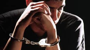 handcuffed youth