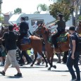 MINOR SCUFFLE: An Anaheim Police officer and an Orange County Sheriff’s Deputy, both mounted on horseback, use long sticks to prod anti-police brutality protesters off the streets and onto the sidewalks […]